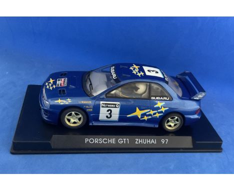 Model Car Subaru Impreza WRC Blue no.3 race car in display case. Measures 5 inches appx. Good condition. We combine postage o