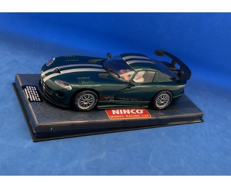 Scalextric Porsche Viper GTS R Green race car in display case. Measures 5 inches appx. Good condition. We combine postage on 