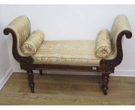 A Regency carved mahogany scroll end recently reupholstered window seat on turned shaped octagonal legs with Rotary Patent re