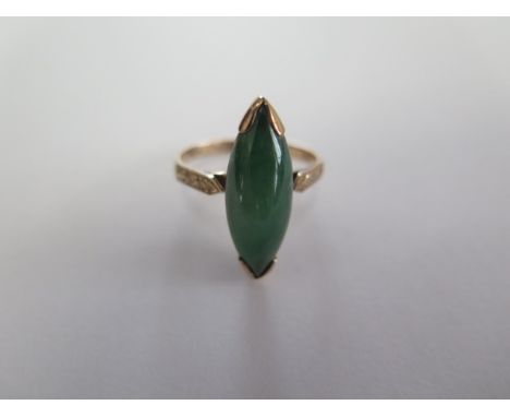 A 14ct yellow gold green jade ring size M - approx weight 4.3 grams - generally good condition 