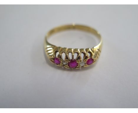 An 18ct yellow gold hallmarked diamond and ruby type five stone ring size N/O - approx weight 2.9 grams - generally good, som