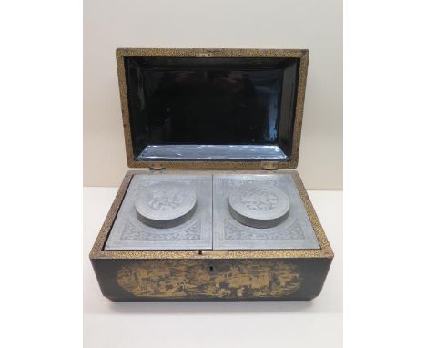 An Oriental gilt lacquered tea caddy with decorated pewter type two section interior - Height 16cm x 31cm x 20cm - some wear 