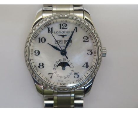 A Longines Master collection stainless steel diamond bezel gents automatic bracelet wristwatch with mother of pearl day/date 