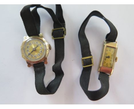 Two 9ct yellow gold manual wind ladies watches on cloth straps - total weight approx 19.5 grams - ex jewellers stock 