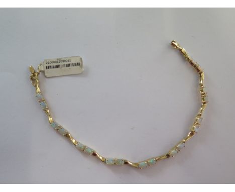 A 14ct yellow gold opal bracelet - approx weight 6 grams - RRP £795 - approx weight 6 grams - in good condition 