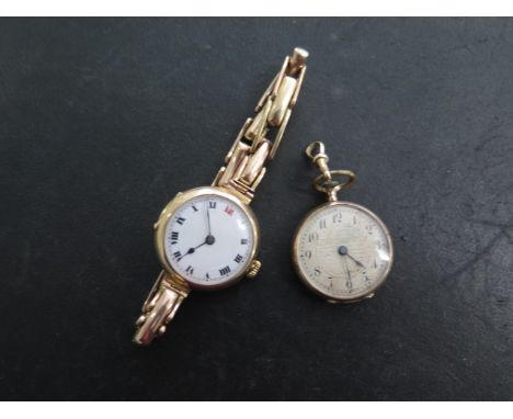 A 9ct yellow gold manual wind wristwatch on a sprung 9ct strap - running, repair to strap - and a small 9ct pocket watch - ru