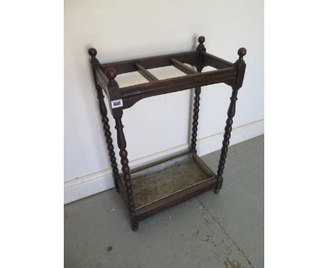 An oak bobbin turned stick stand - Height 71cm x 47cm x 27cm 