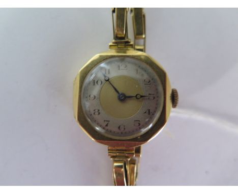 An 18ct yellow gold manual wind ladies wristwatch on 18ct sprung strap - running - approx weight 17.4 grams 