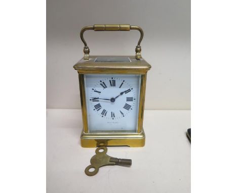 A brass carriage clock the dial signed Ross &amp; Son - working with key 