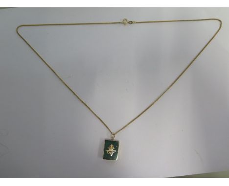 A 14ct yellow gold Jade pendant on a 14ct 60cm chain, pendant 2cm x 1.5cm - some small chips to Jade otherwise good - total w
