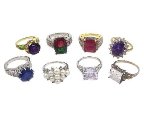 Eight silver and silver-gilt stone set dress rings including cubic zirconia dress rings, pearl cluster and mystic topaz ring,