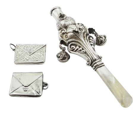 Early 20th century silver mounted child's rattle, the shaped scrolling silver body with suspension bells, floral embossed whi
