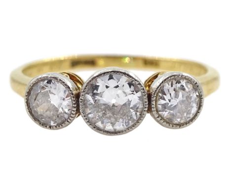 Art Deco milgrain set three stone diamond ring, stamped 18, the inside inscribed 'Amor Vincit Omnia' and dated 10.9.25, total