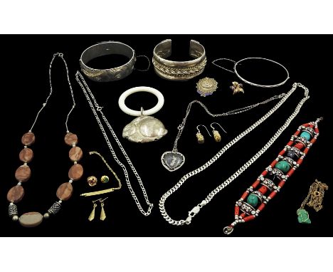 Heavy Egyptian silver bangle, two other silver bangles, silver chain necklaces, silver baby rattle, stone set necklace and br