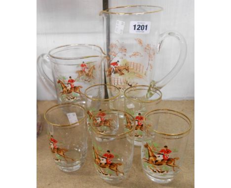 A vintage glass part lemonade set comprising large jug and five glasses decorated with transfer printed hunting scenes - sold