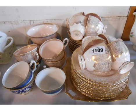 A Tuscan china part tea set comprising eleven trios, sugar bowl and bread and butter plate - sold with three Crown Staffordsh