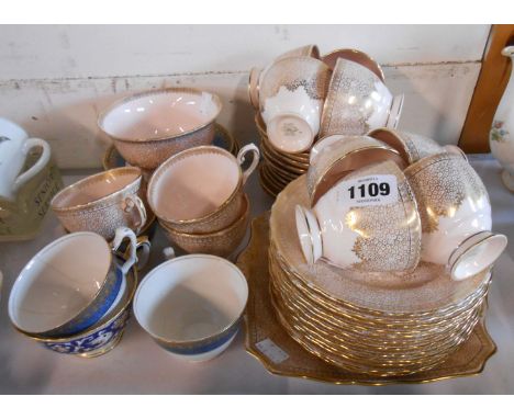 A Tuscan china part tea set comprising eleven trios, sugar bowl and bread and butter plate - sold with three Crown Staffordsh