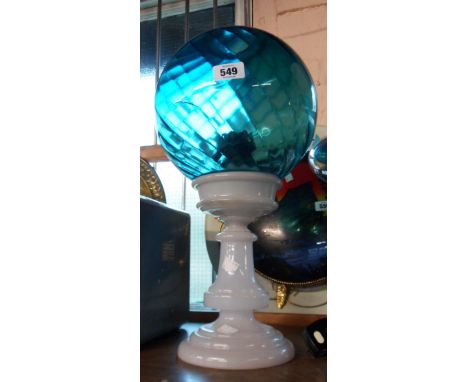 A Victorian opaque glass oil lamp with later blue glass globe shade