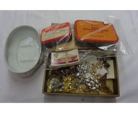 A box containing a small quantity of recovered stamps in vintage tins and on paper, part set of tea cards, small quantity of 