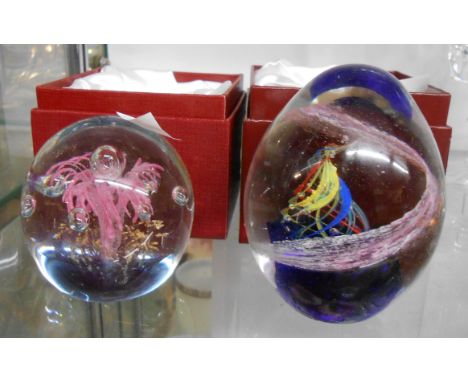 Two modern glass paperweights with internal lampwork and enamel decoration in original boxes