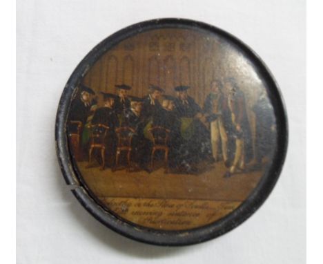 An early 19th Century papier-mache snuff box with applied print to the lid with a depiction of Golgotha or The Place of Scull