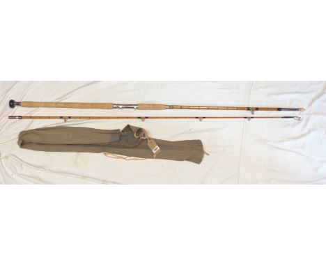 A 10' 2" vintage Modern Arms Co., 'Silver King' two section Steel Core, Elasticane boat rod with wooden rod plug - in canvas 