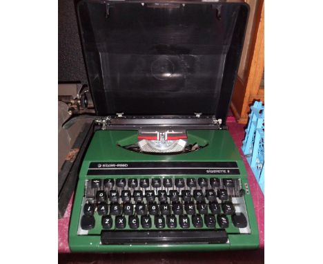 A vintage Silver-Reed Silverette II portable typewriter in green colourway with original fitted case