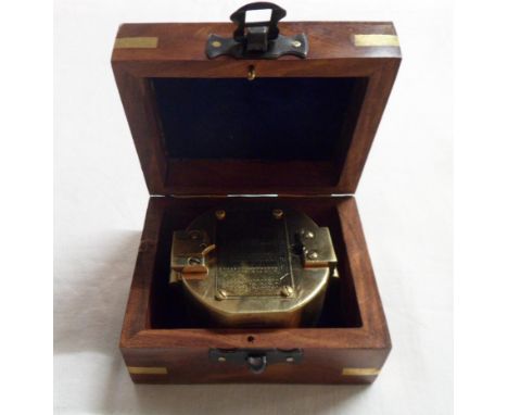 A modern brass reproduction compass in brass bound wooden box
