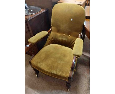 An early 19th Century mahogany part show frame drawing room armchair with button back upholstery and scroll armrests, set on 