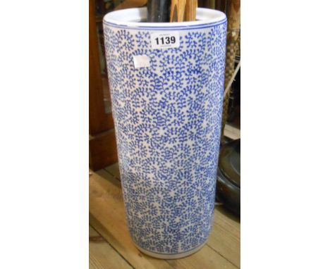A modern porcelain stick stand with blue and white transfer printed decoration