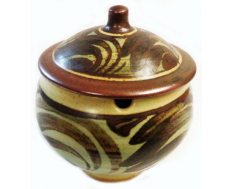 Bernard Leach: a Leach Pottery St Ives preserve pot and lid with brush painted stylised leaf decoration on a dark oatmeal gla