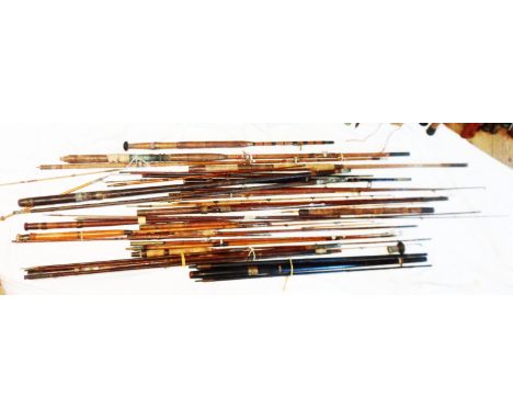 A quantity of mainly vintage greenheart part fishing rods incliding tips, mid and butt sections, also dark wood and other par