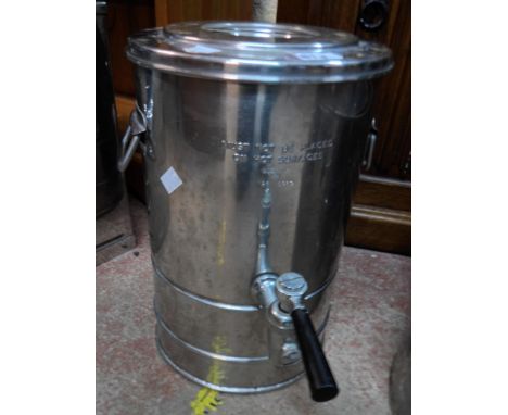 A vintage stainless steel tea urn with W-D arrow dated 1974