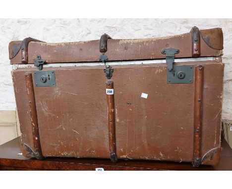 An 84cm Standex Trunks travelling trunk with brown canvas weather coating and leather bound corners - a/f