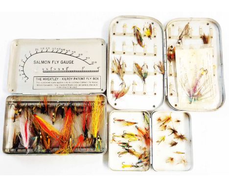 A 6" vintage Wheatley 'Silmalloy' fly case containing a selection of salmon flies - sold with a 3 1/2" similar containing mai