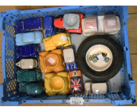 A box containing a quantity of ceramic model car cruets, egg cups, etc.