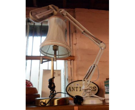 A modern anglepoise lamp made by The Daylight Company - sold with a modern brassed effect metal table lamp with adjustable to