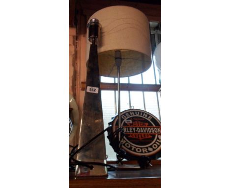 A modern chrome plated lamp of tall obelisk form - sold with another lamp