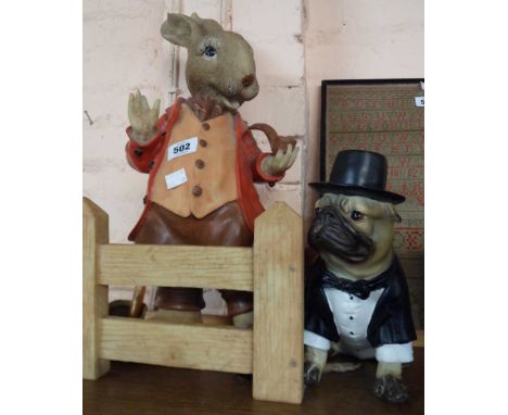 A resin figure of a Beatrix Potter style rabbit smoking a pipe - sold with an associated resin fence panel and a further resi