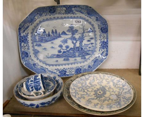 A large antique Chinese blue and white meat platter with hand painted decoration depicting a lakeside scene - sold with an 18