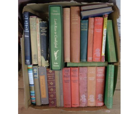 A box containing a quantity of vintage hard back books including 'Jane' series titles, Ronald Searle and Ian Fleming, etc. - 
