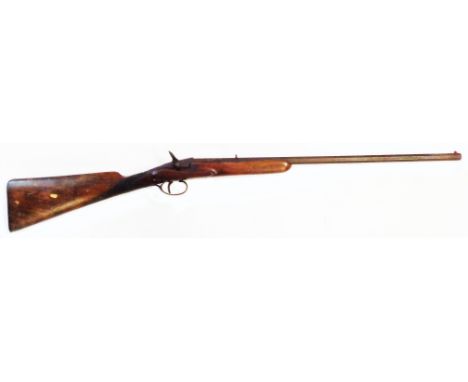 A 19th Century sporting gun with short octagonal barrel and wooden stock - hammer filed