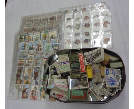A box containing a collection of loose and sleeve mounted cigarette cards, also others in cigarette boxes, including Senior S
