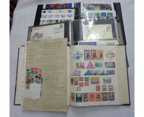 A ring bound stock album containing a collection of mint GB mainly commemorative stamps and stamp packs - sold with another a