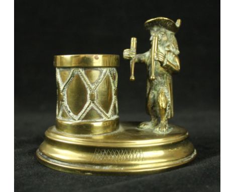 A late 19th Century brass table match striker
Modelled in the form of a monkey playing a drum, height 9.5cm 