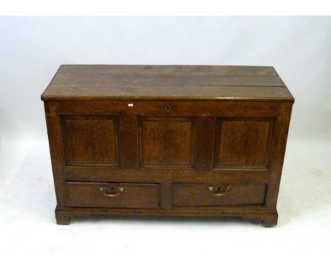 An 18th Century and later oak mule chest
Of typical form, the front with three panels and two drawers, raised on bracket feet