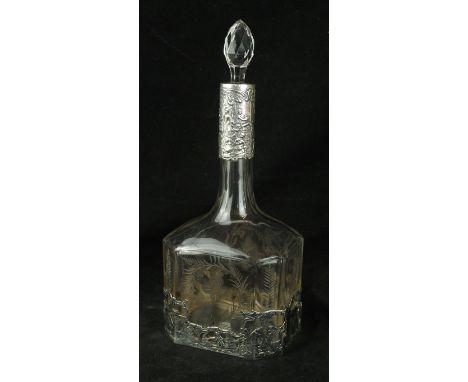 An early 20th Century continental silver mounted and cut glass decanter
Probably Dutch, of baluster form, the silver mount em