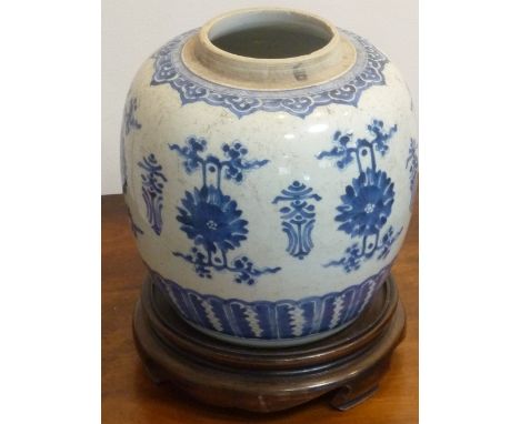 A Chinese Kangxi period porcelain Jar, the neck with a Ruyi band border above chrysanthemums flanked by stylised characters, 