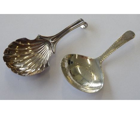 A late 18th century hallmarked silver Caddy Spoon with bright cut decoration to the handle and bowl, makers mark TW, together