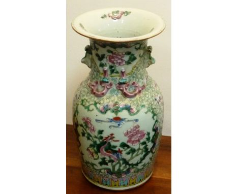 A mid-19th century Chinese Canton porcelain Vase decorated in enamels in the famille rose palette, the flaring neck above two